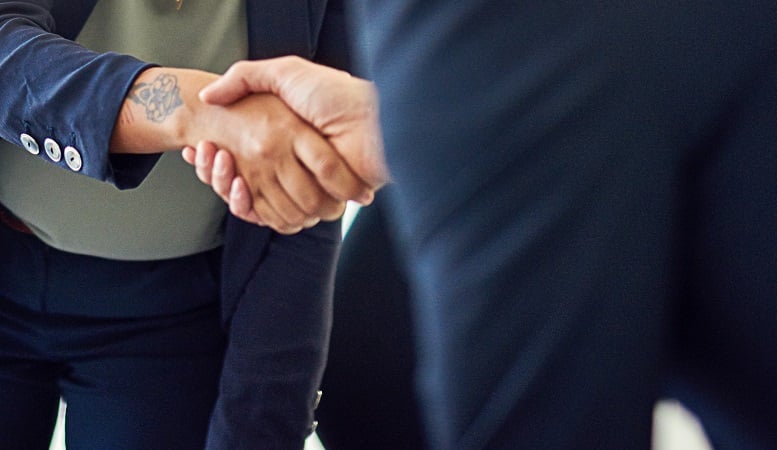 Handshake with a tattoo